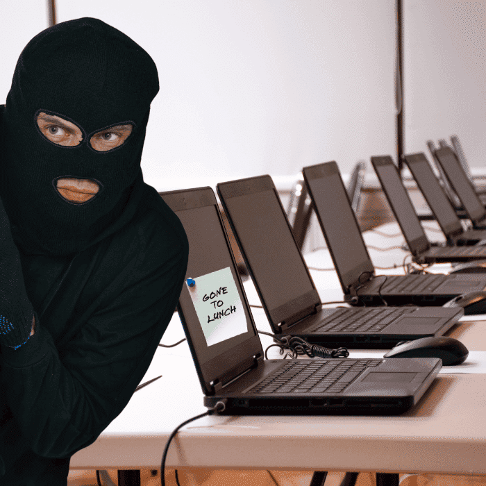a burglar stealing patient data from open laptops